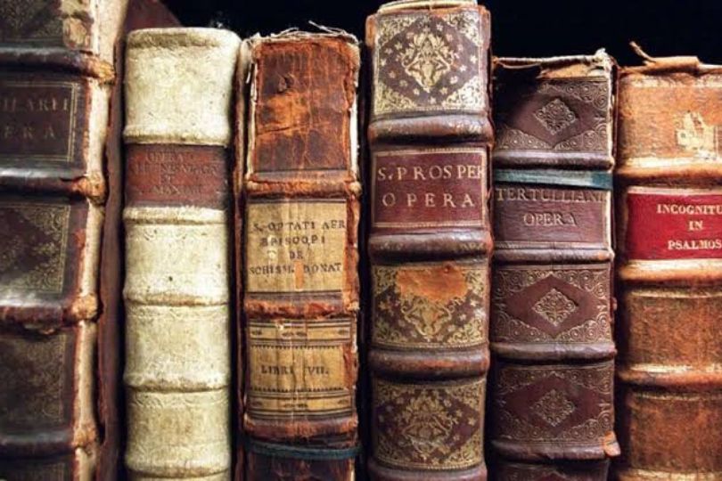 books stacked on a bookshelf
